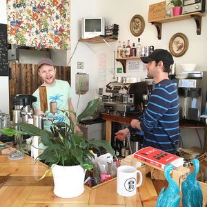Brett Gregory and Eric Obenauf behind the bar at Two Dollar Radio Headquarters in Columbus