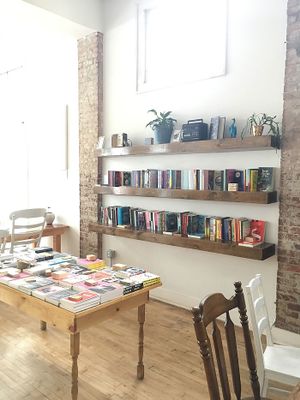 Shelves and tables full of independently published books at Two Dollar Radio Headquarters in Columbus