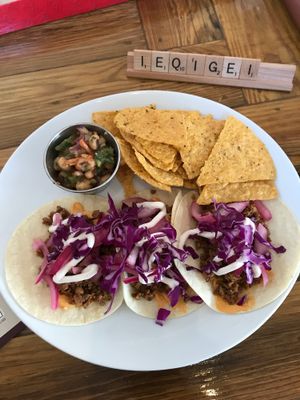 Tacos with chips & cowboy caviar at Two Dollar Radio Headquarters in Columbus