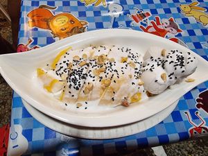 Mango sticky rice with coconut ice cream and black sesame seeds at Kohco Man in Koh Phayam
