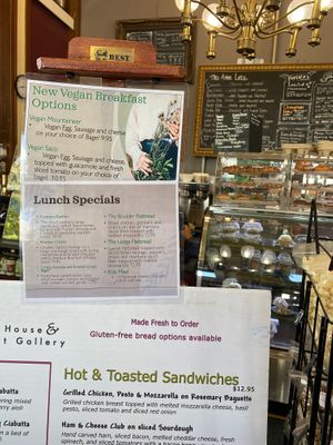 Menu showing new vegan breakfast options and display case featuring vegan pastries and donuts.  at The Met Coffee House and Art Gallery in North Conway