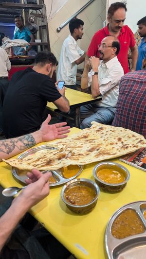 Giant naan, arm sized and wouldn't even fit on the table! at Kake di Hatti in New Delhi