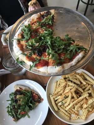 Vegan French Fries & Vegan Pile pizza w/ Cashew ricotta & gluten-free crust.  at King Dough in Indianapolis