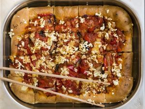 Pizza with veggies and vegan parmezan at The Saints Stores in Thessaloniki