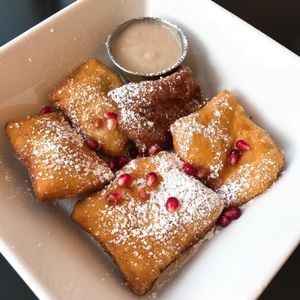 New Orleans style Beignets with sweet bourbon coffee custard dip at Detroit Street Filling Station in Ann Arbor
