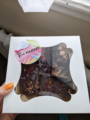 Selection of vegan cakes decorated with edible flowers at The Nakery in Liverpool