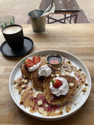 Blueberry biscoff pancakes & oat latte  at Serenity Now in Glasgow