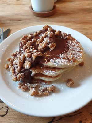 Brownie pancakes with candied nuts and chocolate sauce at Shoe Tree Cafe in Newcastle Upon Tyne