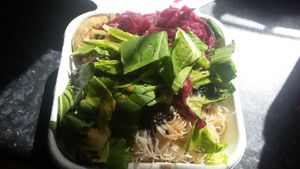 Rice noodles with sesame, pak choi, pickled red cabbage and aubergines salad box at Shoe Tree Cafe in Newcastle Upon Tyne