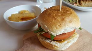 Gourmet burger and cassava chips at Essential Vegan @ Ten to One Bar in North London