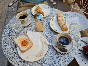 Coffee and tasty sweet pastry at L'Exquisit in Mallorca