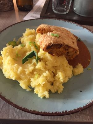 puffp astry roll filled up with sauerkraut and smoked tofu, mashed potatoes at Forrest Bistro in Prague