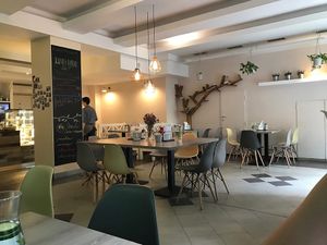 Interior and a friendly waiter in the background  at Forrest Bistro in Prague
