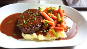 Burger with mashed potatoes,  gravy and steamed vegetables at Forrest Bistro in Prague