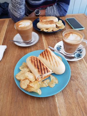 Humous and tomato panini and oatmilk lattes at Cafe Calluna in Pitlochry