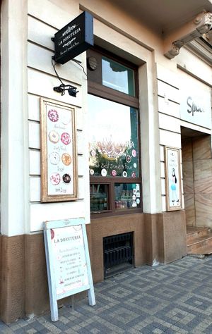 Store front with take away window from the street at La Donuteria in Bratislava