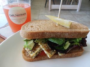 Vegan club sandwich was a special. Plus mango kombucha. at Cafe Nutrients in Naples