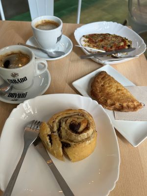 Pizza, empanadas and cinnamon rolls   at Vegan Bombon in Alicante