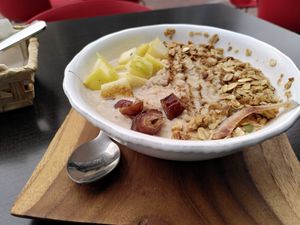Oatmeal bowl with granola, dates and apples at Amelie Green in Gran Canaria