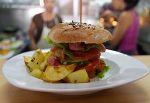 Homemade vegan hamburguer with potatos, sweet potatos and vegan sauce. Made by tofu, quinoa, shiitake mushrooms, algae...Terra Incógnita changes it every week.  at Amelie Green in Gran Canaria