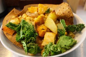 "El Nido", crunchy special bread with coconut lemongrass sauce, chickpeas, roast vegetables and  sweet potatos. Crunchy kale on the top. Honestly delicious!  at Amelie Green in Gran Canaria