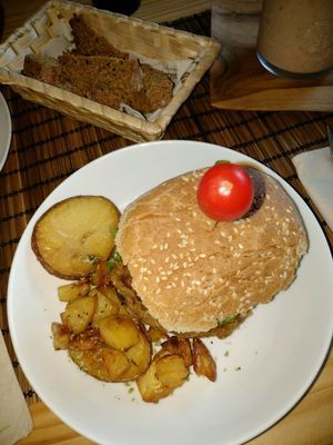 Lentil burger with sweet potato fries and guacamole at Amelie Green in Gran Canaria