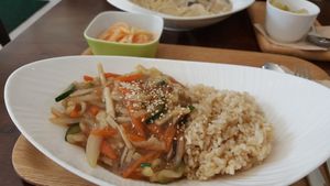 Brown rice topped with yellow bean sauce. Nice! Love the texture of the rice. at Sun - 카페 in Seoul