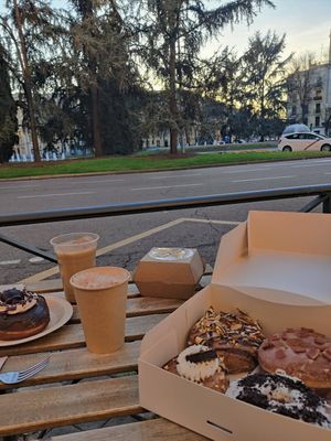 Doughnut and chai on the terrace at Bite Me Cafe in Madrid