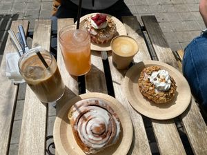 We got a iced latte with oat milk, normal coffee and delicious handmade Lemonade with Kiwi and Strawberry, sweet and good!   at Bite Me Cafe in Madrid