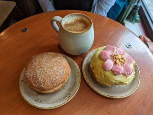 Chai, pistachio donut and strawberry filled donut at Bite Me Cafe in Madrid