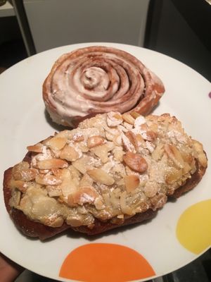 Cinnamon roll and almond croissant at Bite Me Cafe in Madrid