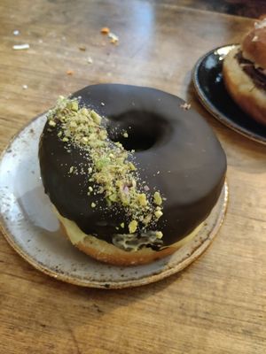 Pistachio chocolate doughnut at Bite Me Cafe in Madrid