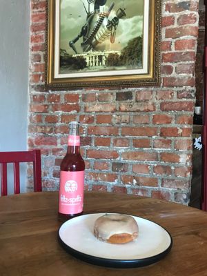 Ruibarb drink and olive oil and rosemary donut at Bite Me Cafe in Madrid