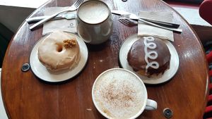 Maple doughnut and whiskey Boston Cream doughnut at Bite Me Cafe in Madrid