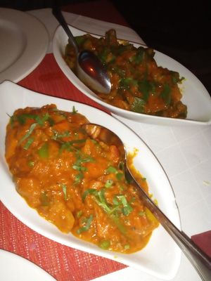 Mix vegetables with Curry in front and Orkra with spicy sauce in the black. at Annapurna in Fuessen