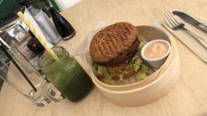 Lentil and chickpea burger with green smoothie  at Garden Fresh Cafe in Palm Beach