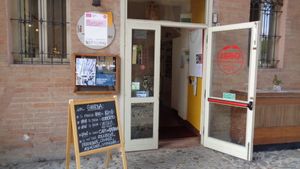 Entrance of Ghirba under the arch. at Ghirba Biosteria della Gabella in Reggio Emilia