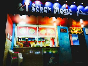 Entrance and takeaway counter at night.  at Sohar Magic in Sohar