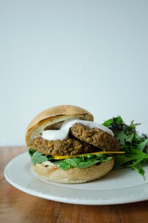 Lentil & chickpea fritter sandwich, with garlic tahini dressing at Farm'r Eatery & Catering in Toronto