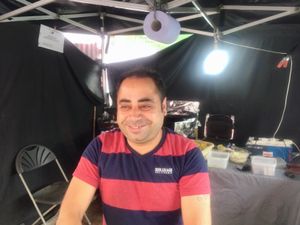 Happy Mohamed at Falafel Hummos and Salad Wrap - Market Stall in East London