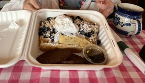 Blueberry waffles with real maple syrup and vegan whipped cream & vegan sausages at Auntie Cathie's Kitchen in Agawam