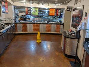 View of raw bar area veggies are along the back with noodles, meat is on the left, sauces just out of this picture on the left. at Fire + Ice in South Lake Tahoe