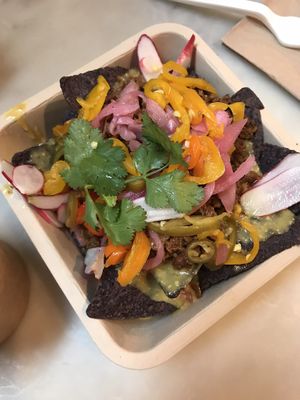 Impossible meat crumble nachos with “scratch” queso  at Taco Dumbo - Penn Plaza in New York City