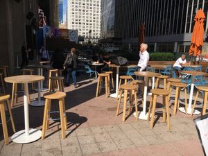 Outside tables at Pennsys Food Court at Taco Dumbo - Penn Plaza in New York City