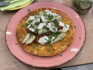 Potato pancake with vegan feta, artichokes and pickled tomatoes - Café Alter Markt, Euskirchen  at Cafe Alter Markt in Euskirchen