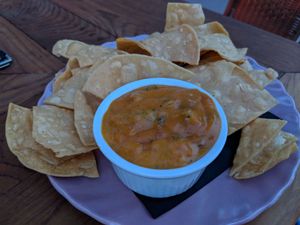 Carrot Queso with chips at Strange Town in Milwaukee