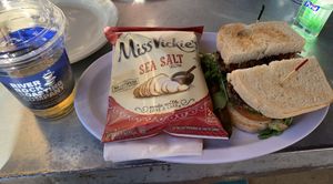 Vegan black bean burger, served with pickle spear and chips(which I accidentally made the focus of the pic here 😅)  at River Rock Roasting Company in La Verkin