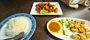 Left to right: boiled rice; sweet and sour chicken; chicken skewers w/ satay sauce at Yi Xin Vegetarian 一心素食 in Central Singapore