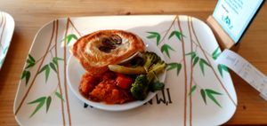 Eden Kitchen: Mushroom and leek pie and three vegan sides (all sides were vegan). This was really good and not excessively greasy because pastry was only on top. 8.95 at Eden Project in St Austell