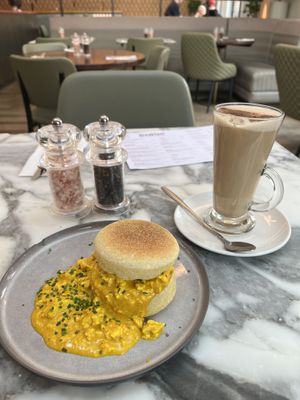 Scrambled muffin and chai latte  at Wulf & Lamb Chelsea in London